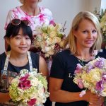 women displaying flowers