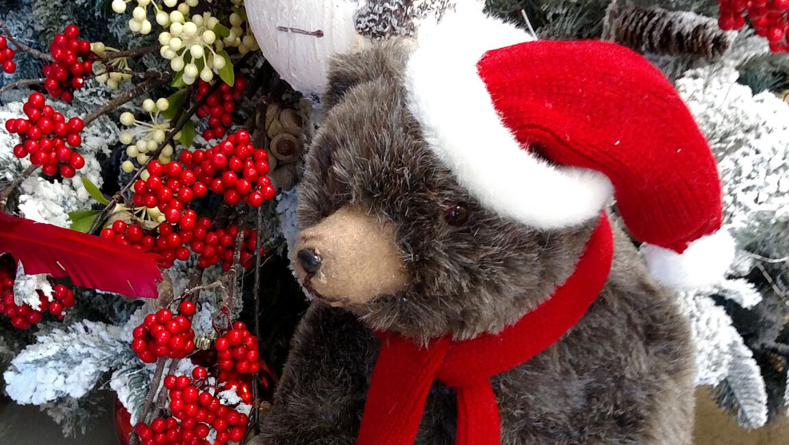 holiday flower decorating with bear